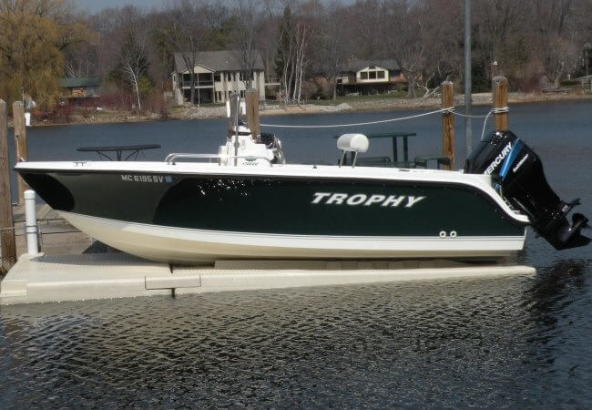 Floating boat lift for waterfront and marina installations