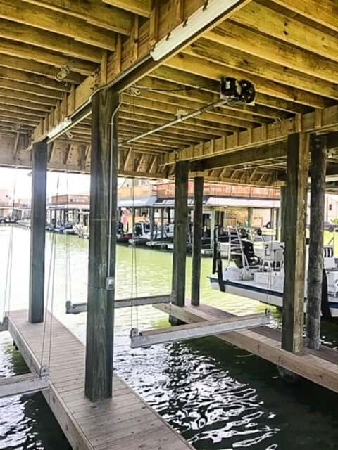 Double lined aluminum cradle boat lift with durable corrosion-resistant construction for stable marine boat support